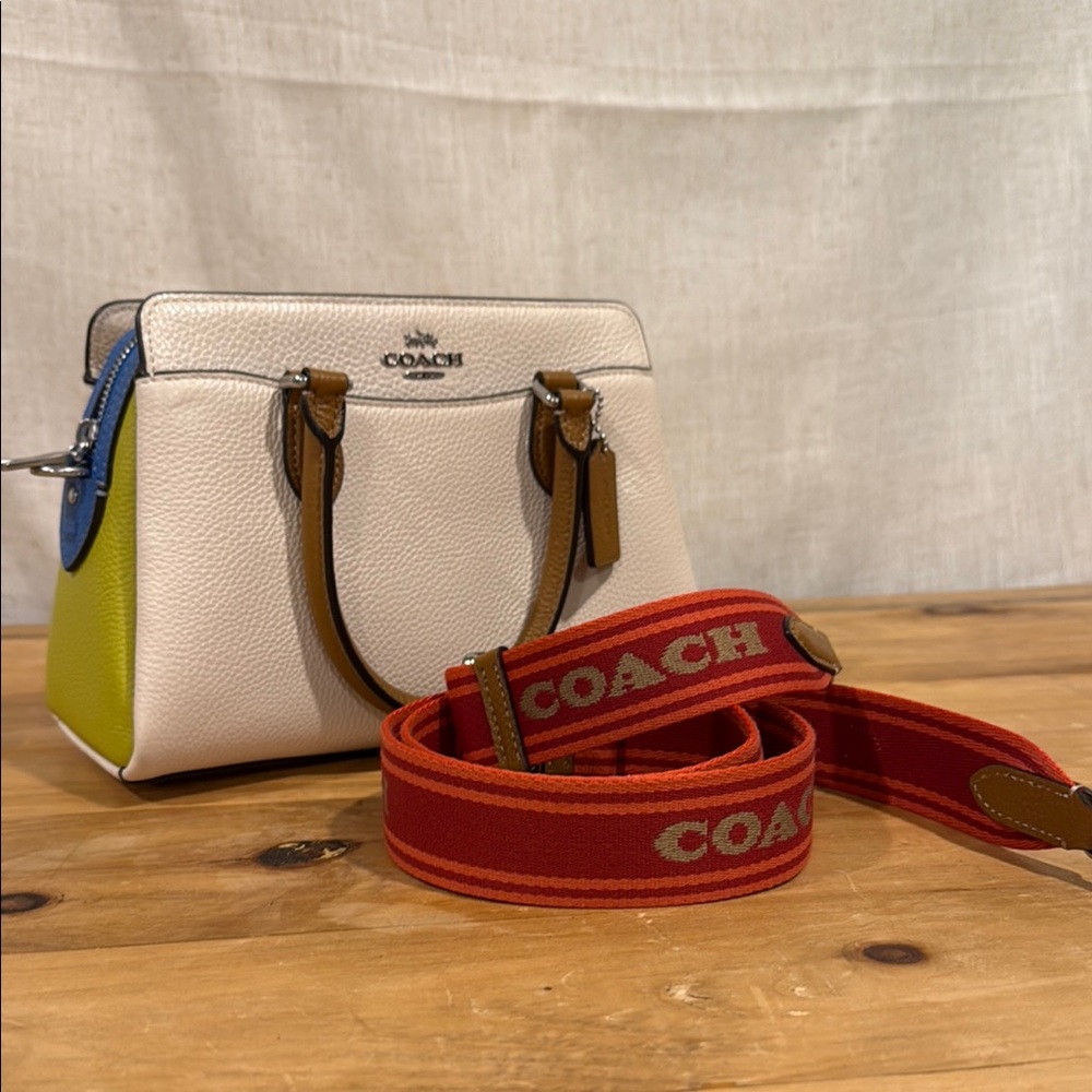Coach, multi color, never used, crossbody with fun guitar red guitar strap
